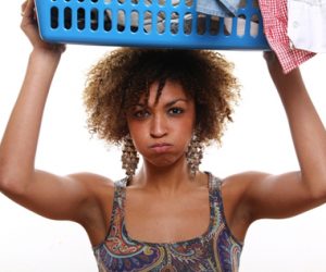 woman-holding-laundry-basket-above-head